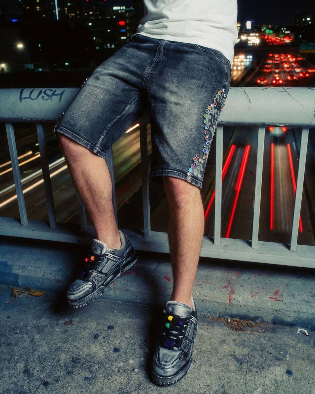 PREME denim on a city bridge at night